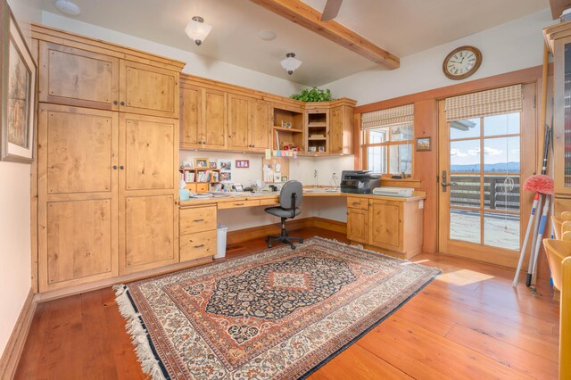 27744 Lee Rd, Mcarthur, CA 96056 - office space with built in study area, beam ceiling, and light wood-style floors