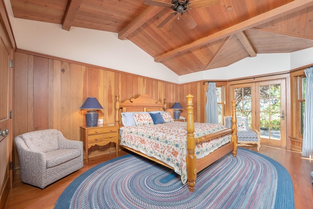 bedroom featuring hardwood / wood-style flooring, ceiling fan, vaulted ceiling with beams, wooden ceiling, and access to exterior