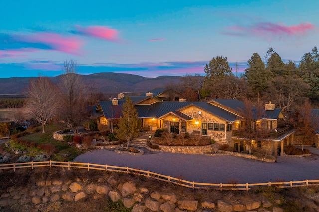 27744 Lee Rd, Mcarthur, CA 96056 - exterior space with a standing seam roof, fence, metal roof, stone siding, and a chimney