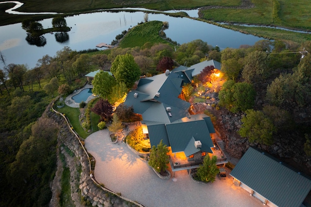 birds eye view of property featuring a water view