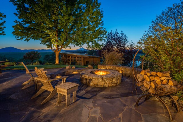 27744 Lee Rd, Mcarthur, CA 96056 - patio terrace at dusk featuring a fire pit