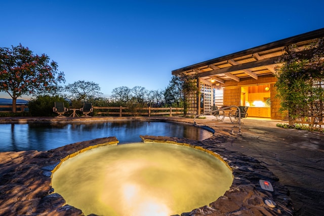 view of swimming pool with a patio area and an in ground hot tub