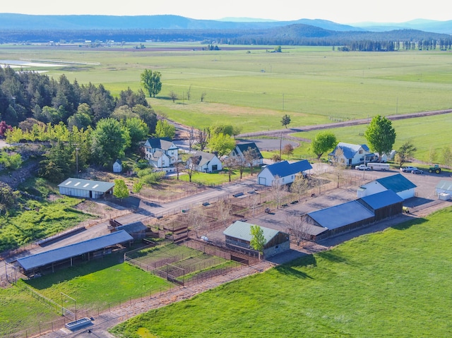 drone / aerial view featuring a mountain view and a rural view