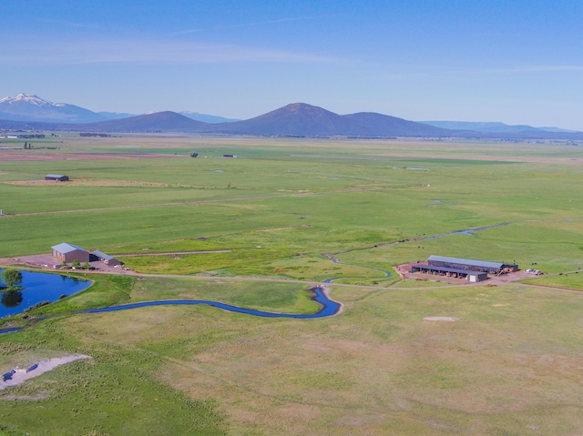 aerial view with a mountain view and a rural view