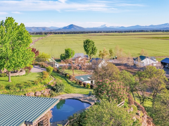 bird's eye view featuring a water and mountain view and a rural view