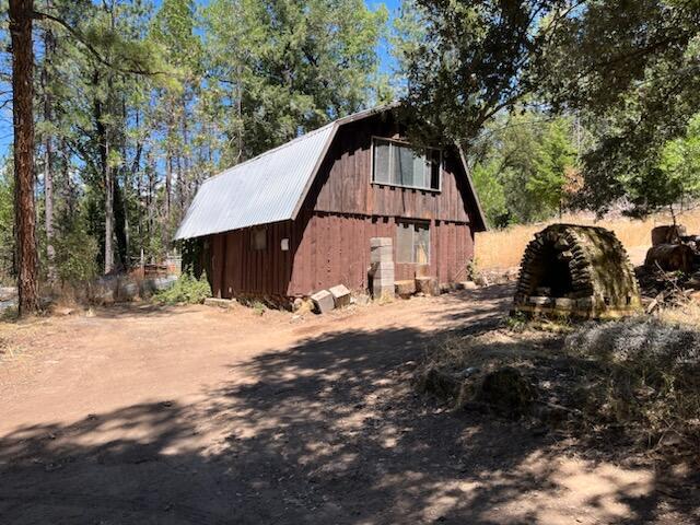 view of side of home with an outbuilding