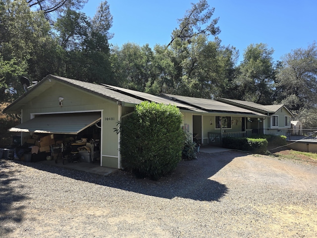 view of front facade with a garage and a porch