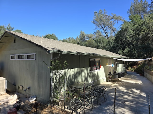 view of side of property with a patio