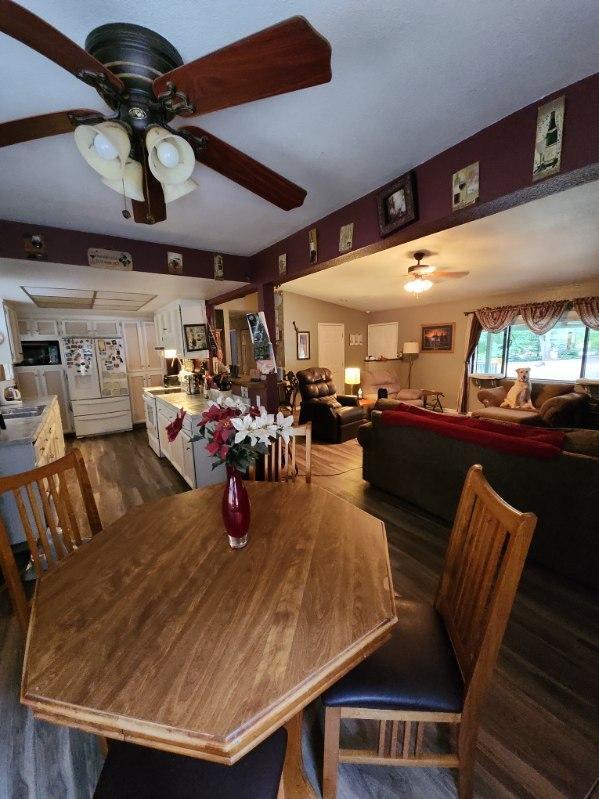 dining space featuring dark wood-type flooring