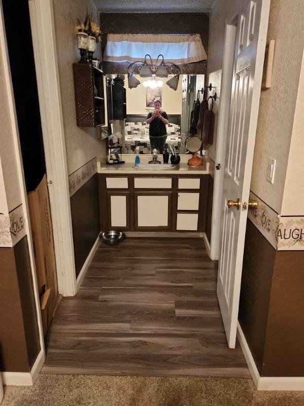 kitchen featuring sink and dark hardwood / wood-style floors