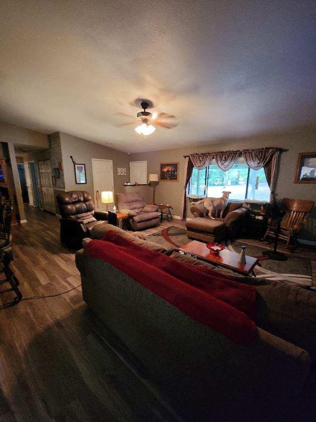 living room featuring lofted ceiling, a textured ceiling, ceiling fan, and hardwood / wood-style flooring