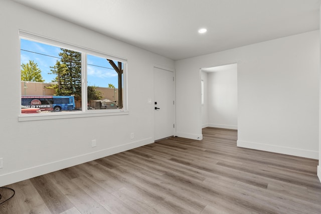 unfurnished room featuring light hardwood / wood-style flooring