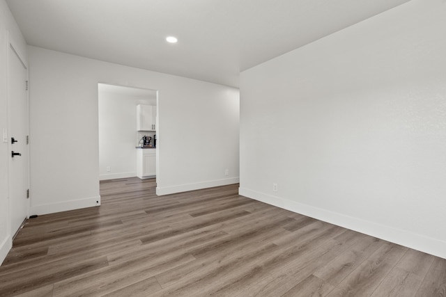 spare room featuring light wood-type flooring