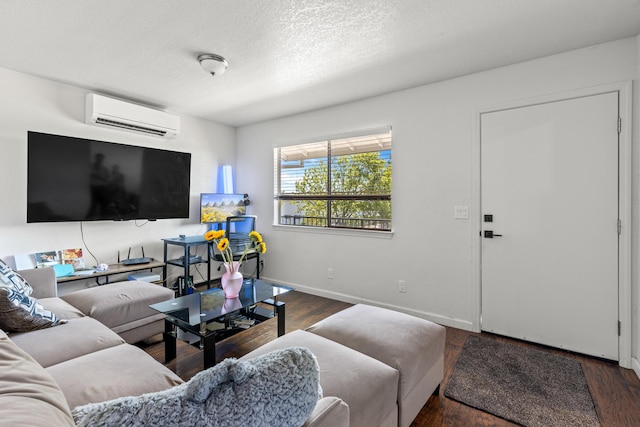 living room with an AC wall unit, a textured ceiling, and dark hardwood / wood-style floors