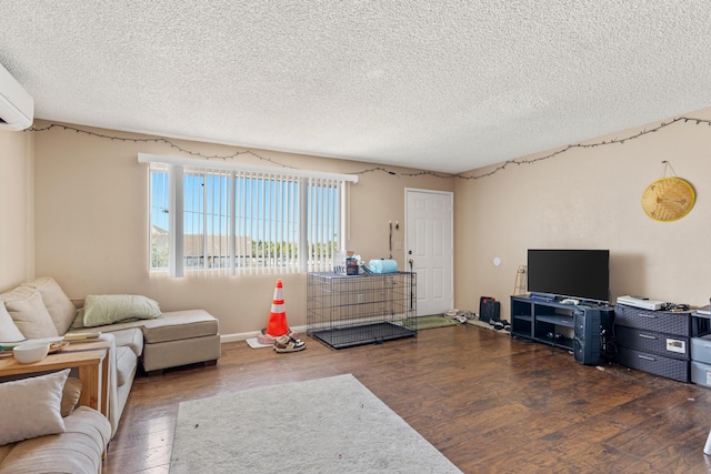 living room with dark hardwood / wood-style floors and a textured ceiling