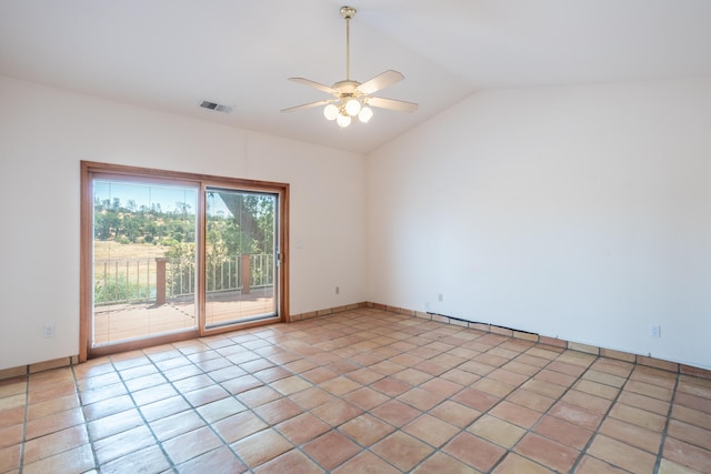 tiled empty room featuring lofted ceiling and ceiling fan