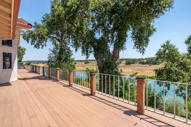 wooden deck featuring a rural view