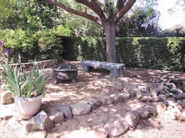 view of patio / terrace with a fire pit