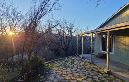 view of side of property with a patio area