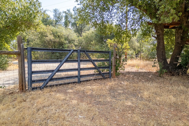 view of gate featuring fence