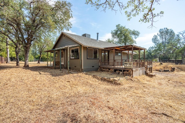 view of front of property featuring crawl space, roof with shingles, and a deck