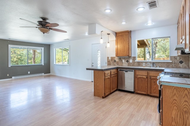 kitchen featuring a baseboard radiator, a peninsula, range with electric cooktop, visible vents, and stainless steel dishwasher