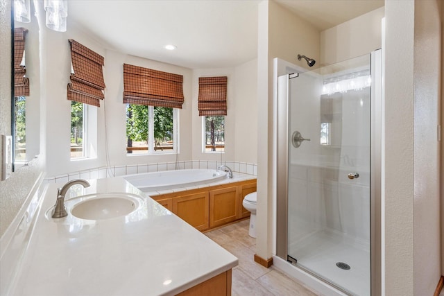 full bathroom featuring vanity, separate shower and tub, tile patterned flooring, and toilet