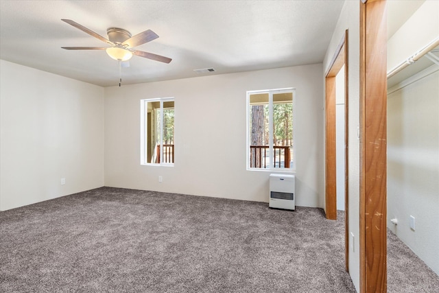 unfurnished bedroom featuring carpet flooring, a closet, and ceiling fan