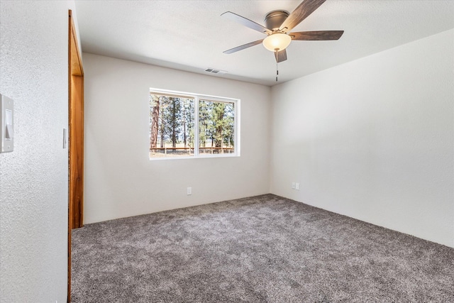 unfurnished room with carpet floors and ceiling fan