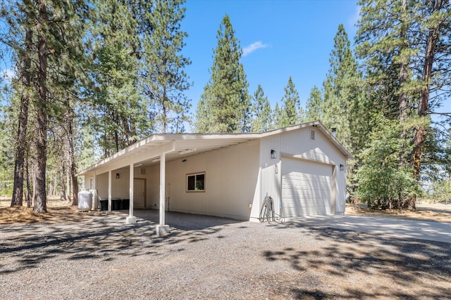 exterior space featuring a carport and a garage