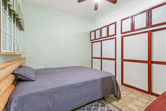 bedroom with tile patterned flooring and ceiling fan