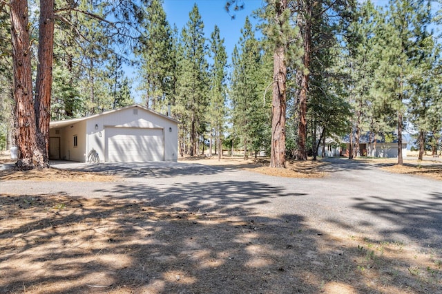 view of side of home with a garage