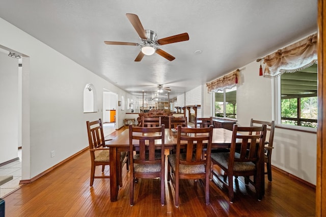 dining area with wood finished floors and baseboards