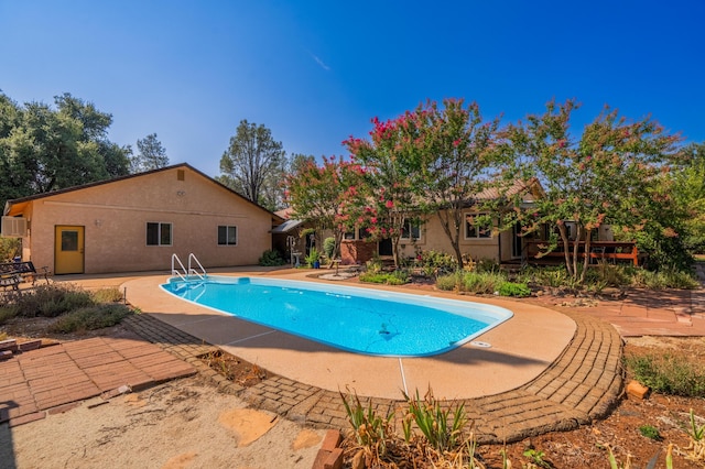 outdoor pool with a patio