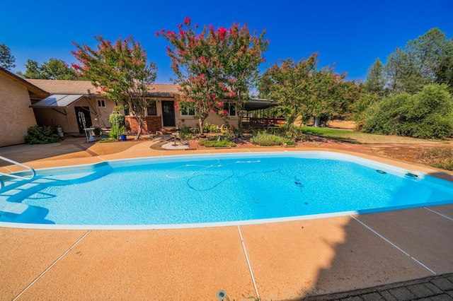 pool with a patio