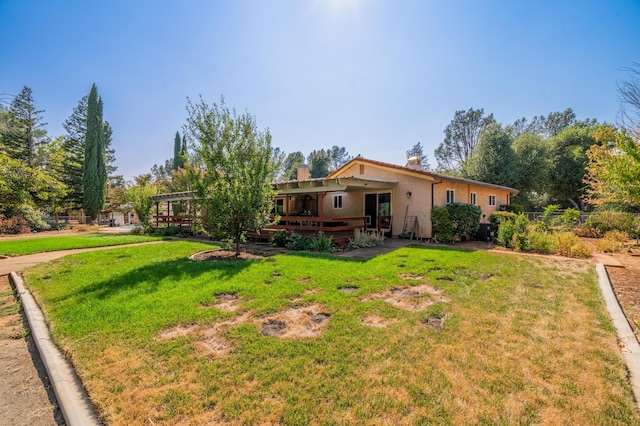 single story home featuring a chimney, a front yard, a pergola, and stucco siding