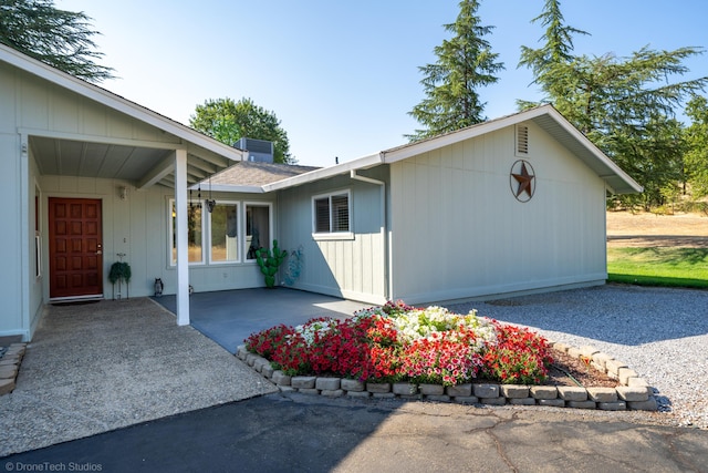 view of home's exterior with roof with shingles