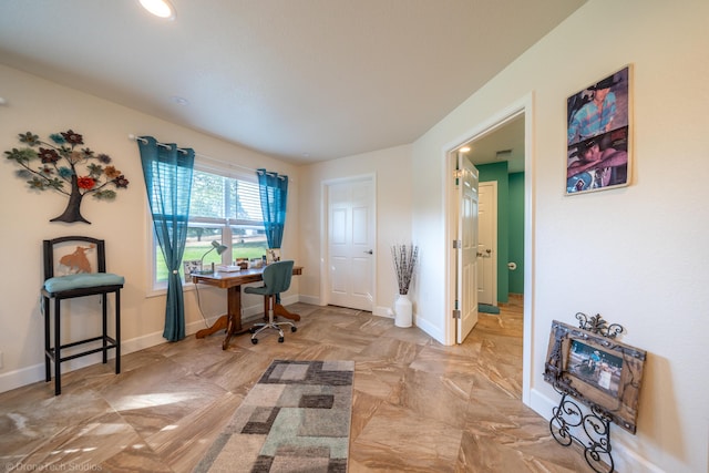 office area featuring baseboards