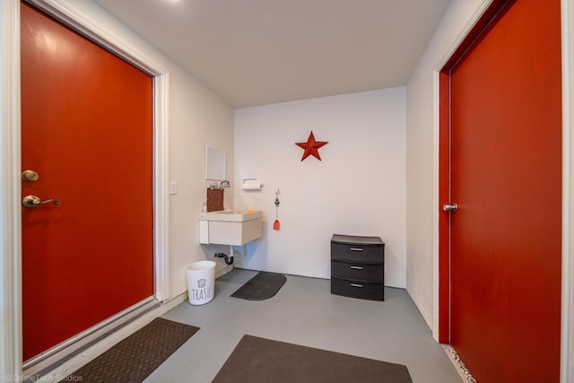 bathroom featuring concrete floors