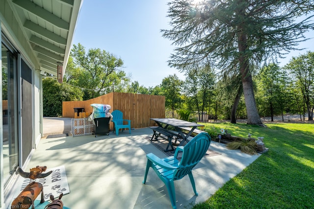 view of patio / terrace featuring fence