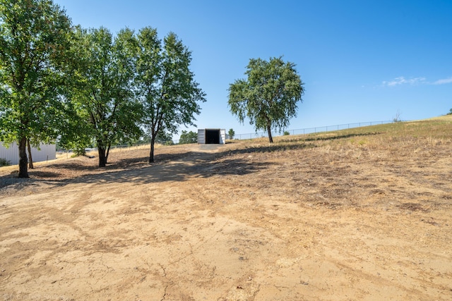 view of yard with a rural view