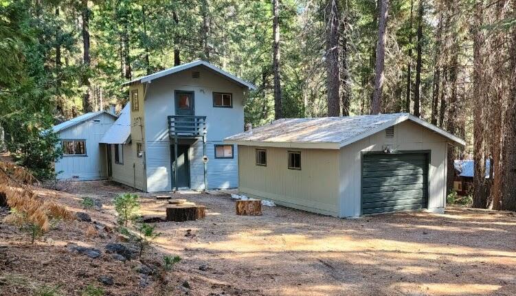 view of front of property with an outbuilding and a garage