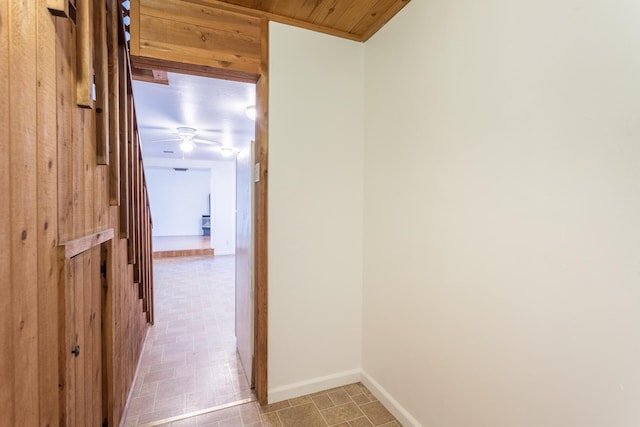 corridor with wooden walls and wood ceiling