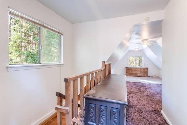 bonus room featuring plenty of natural light, carpet, ceiling fan, and vaulted ceiling