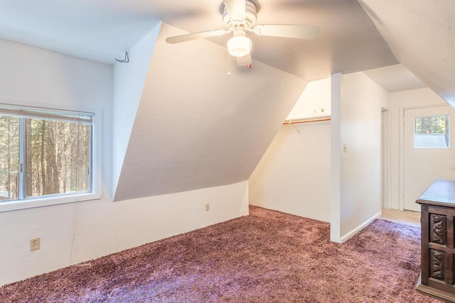 bonus room featuring ceiling fan, lofted ceiling, and carpet flooring