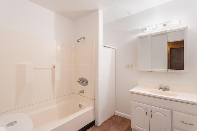 bathroom with wood-type flooring, bathtub / shower combination, and vanity