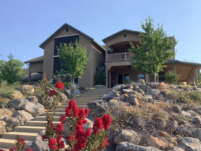 view of front of home with a balcony