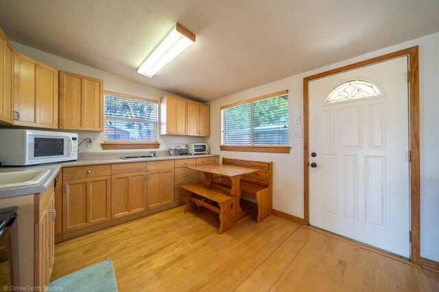 kitchen featuring light wood-type flooring and light brown cabinets