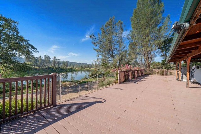 wooden terrace with a water view