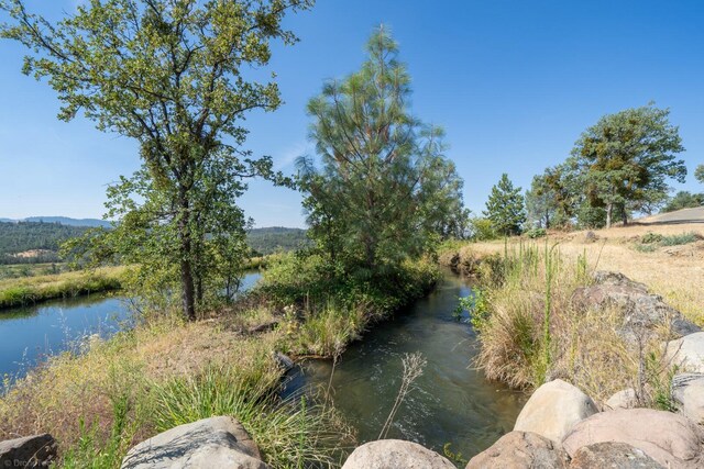 view of yard with a water view